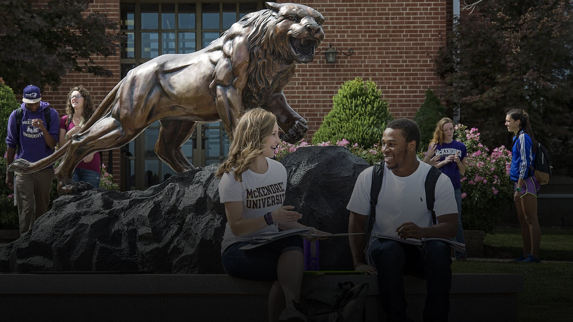 Photo of Students Gathered Around Bearcat Statue