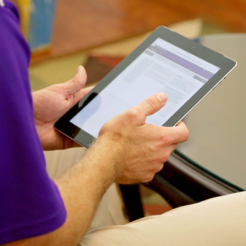 Photo of Person Holding an iPad