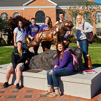 Students Standing With Bearcat Statue