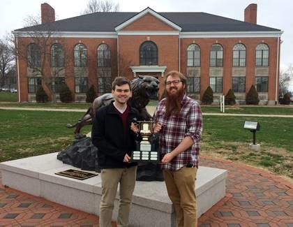 Debaters Alex Baldwin and Gage Simmons with the I-70 Cup