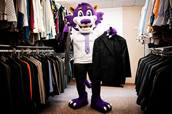 Mascot Holding a Suit and Tie at Bogey's Career Closet