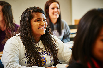 Female Student Smiling in Classroom