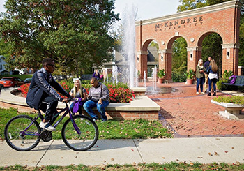 Students Hanging Out at Entryway Monument