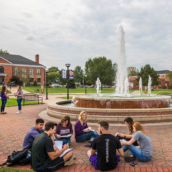 Students Studying Outside Around the Fountain