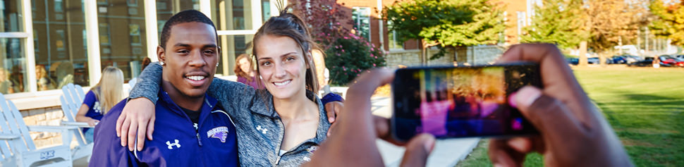 Student Taking Photos of Other Students Using Phone